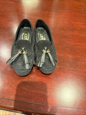 Tod's Black Suede Tassel Loafers with Gold Accents